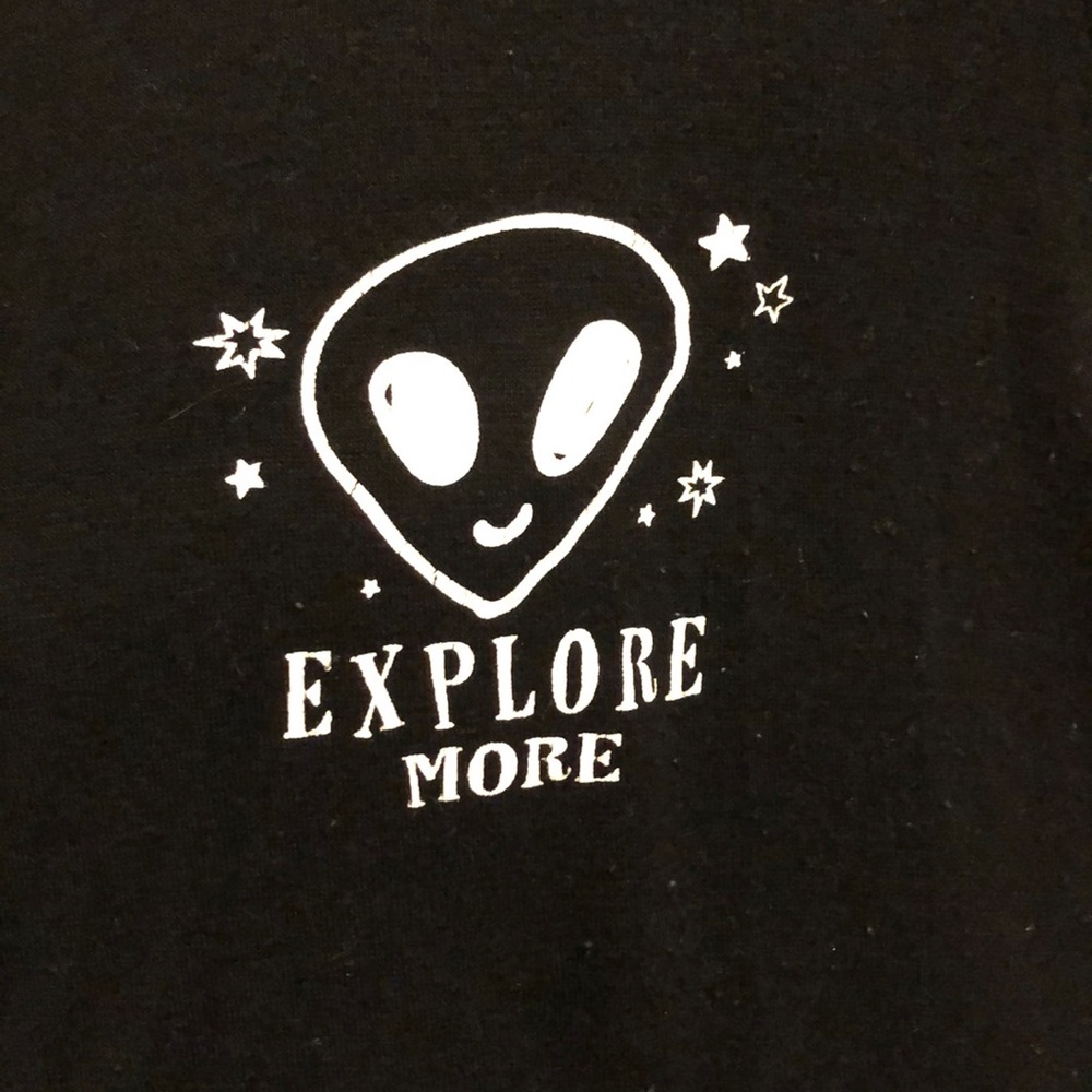 A small black tee with a alien on it!!!!!!!!!!!!!!
